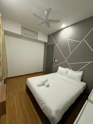 a bedroom with a large white bed with a ceiling at Cozy Comfort- Beacon Executives Suite in George Town