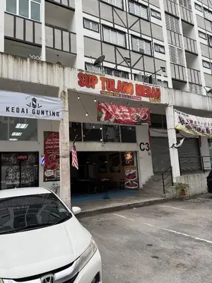 a white car parked in front of a building at AYAAN Comfy Homestay with FREE WiFi in Tanah Rata