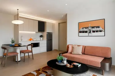 a living room with a couch and a table at Citadines Tanjung Tokong Penang in George Town