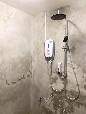 a bathroom with a shower in a room at Pine Armenian in George Town