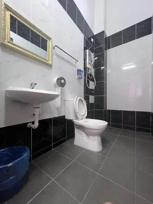 a bathroom with a toilet and a sink at \u73ed\u53f0\u6c11\u5bbf 185 in Pantai Remis