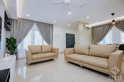 a living room with two couches and windows at Ipoh Mansion House 25 by Verve in Ipoh