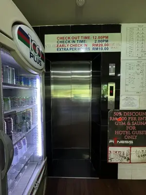 a refrigerator with its door open in a fast food restaurant at Hotel Pinji Ipoh in Ipoh