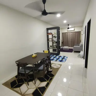 a dining room with a table and a living room at Mimms Homestay Teluk Intan in Teluk Intan