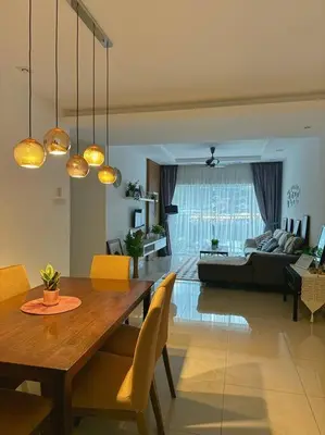 a dining room and living room with a table and chairs at TeaValleyView & FarmView - 3BR Cool Summer Cameron in Cameron Highlands