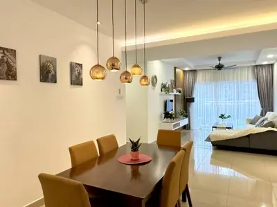 a dining room and living room with a table and chairs at TeaValleyView & FarmView - 3BR Cool Summer Cameron in Cameron Highlands