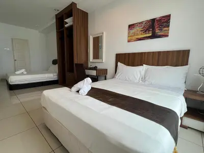 a large bed in a hotel room with a large bed at Mansion One at Gurney Drive Georgetown by 3C in George Town