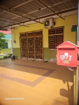 a room with wooden doors and a red box at de'berah homestay penaga in Penaga