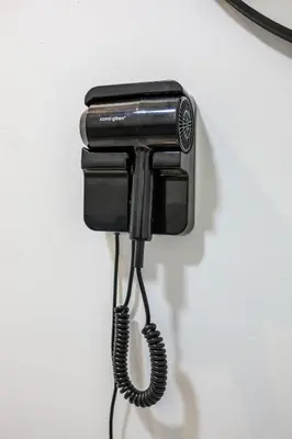 a black phone is hanging on a wall at Premium Family Homestay in Cameron Highlands Clover Home 1-06 in Brinchang