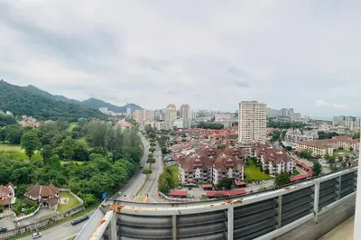 arial view of a city with buildings and a highway at The CEO Suits in Bayan Lepas