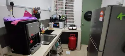a small kitchen with a sink and a refrigerator at Ian's Homestay Tanah Rata C Highlands in Tanah Rata