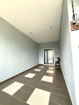 an empty room with a window and a tiled floor at SFS Family Homestay Kulim in Kulim