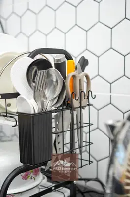 a basket filled with utensils on a kitchen counter at HAZZ Homestay Puncak Ihsan in Kulim