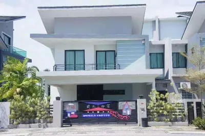 a large white building with a car in front of it at Tranquil lake view retreat \u601d\u6e56\u8336\u5c4b in Ipoh
