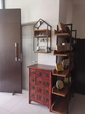 a room with a wooden dresser and a mirror at Tranquil lake view retreat \u601d\u6e56\u8336\u5c4b in Ipoh