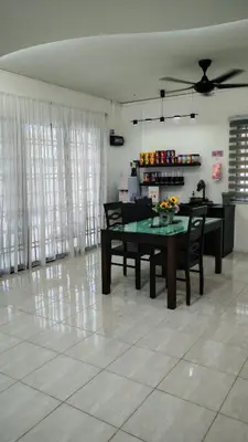 a living room with a dining room table and chairs at 23 Inn Singlebed Room with share bathroom in Bukit Mertajam