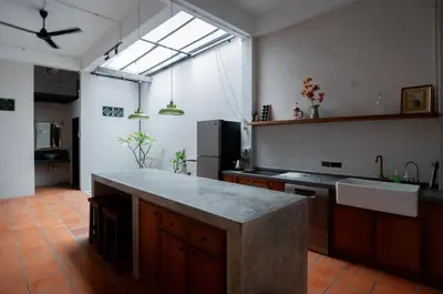 a large kitchen with a counter top and a sink at Carnarvon Villa by Aayu George Town Penang in George Town