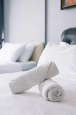 a roll of toilet paper sitting on top of a bed at Seaview Tropicana218 3BR 2CP in George Town