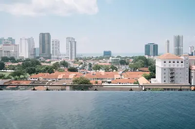 a large body of water with a city in the background at Seaview Tropicana218 3BR 2CP in George Town
