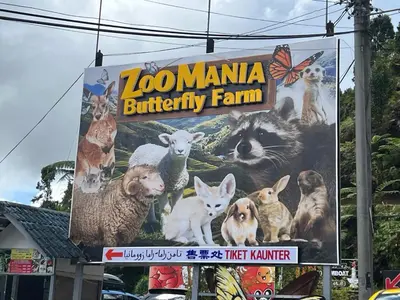 a sign for a poultry farm with animals on it at Eisya Homestay Emerald Avenue Brinchang in Brinchang