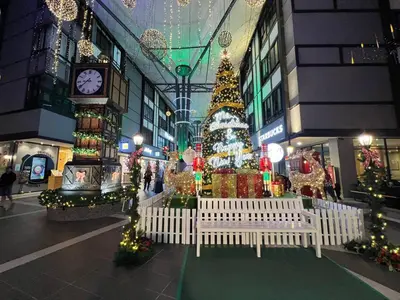 a shopping mall with a christmas tree and a clock at Eisya Homestay Emerald Avenue Brinchang in Brinchang