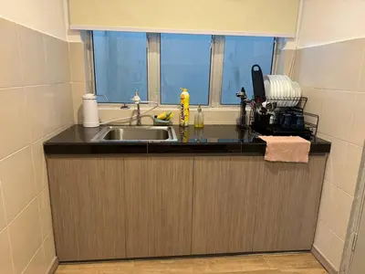 a kitchen counter with a sink and a window at Eisya Homestay Emerald Avenue Brinchang in Brinchang