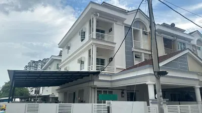 a white building with a white fence in front of it at Jambul Villa 3-storey corner House 6Bed5Bathroom in Bayan Lepas