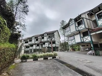 a building on the side of a street at Highland Hideaway 1 Bedroom Apartment at Equatorial Hill Resort in Brinchang
