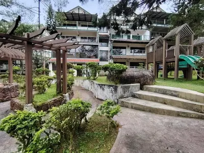 a building with stairs in front of a building at Highland Hideaway 1 Bedroom Apartment at Equatorial Hill Resort in Brinchang