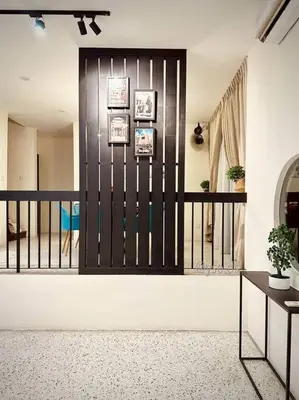 a hallway with a black and white fence at New Grand Muji Style Villa at Central Penang 16pax in Bukit Lada