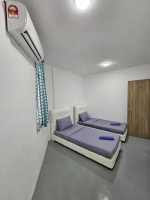 a room with two beds in a room with aactor at SS TWO Hostel Penang in George Town