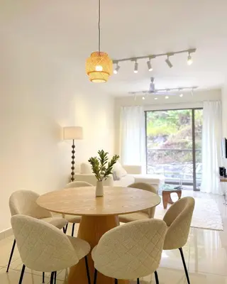 a dining room with a table and chairs at Mizu Homestay Kea Farm 10mins to BOH in Cameron Highlands