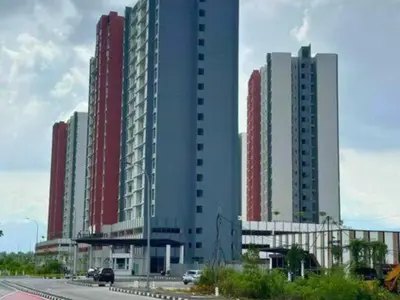 two large tall buildings with cars in front of them at The Anderson Haven Family Suites - Ipoh 2-bedroom Apartment in Ipoh