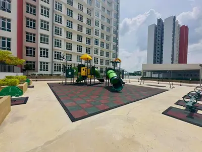 a playground in front of a large building at The Anderson Haven Family Suites - Ipoh 2-bedroom Apartment in Ipoh
