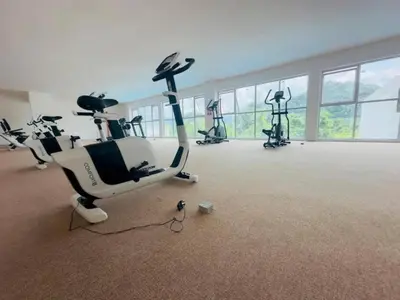 a gym with several exercise bikes in a room at The Anderson Haven Family Suites - Ipoh 2-bedroom Apartment in Ipoh