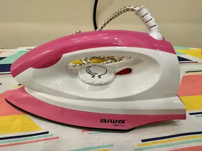 a pink and white toaster sitting on a table at world premium apartment 3BR pool sea view netflix 14pax a27 in Jelutong