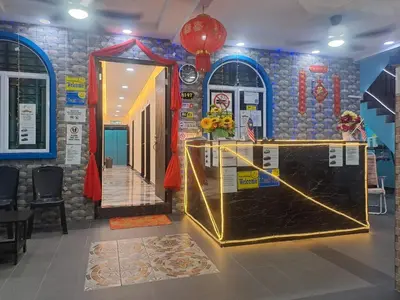 a room with a counter in a room with a wall at SunStar Hotel in Kampong Batu Maung
