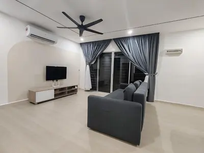 a living room with a couch and a flat screen tv at 3Story Family Suites 7pax Ikea Batu Kawan 5min in Batu Kawan