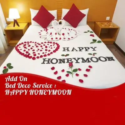 a bed with a happy honeymoon sign on it at Cameron Nova Highlands Resorts II in Brinchang
