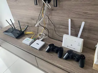 a counter with a bunch of electronic devices on it at Veneto Ipoh homestay 3BR with infinity pool in Ipoh