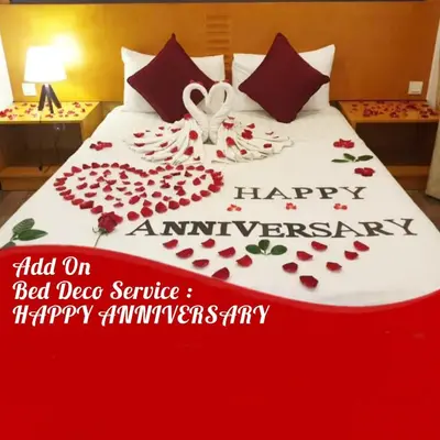 a bed with a happy anniversary sign on it at Cameron Nova Highlands Resorts in Brinchang
