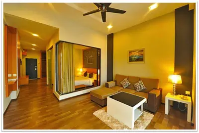 a living room with a couch and a bed at Cameron Nova Highlands Resorts in Brinchang