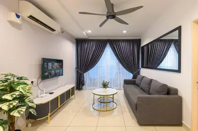 a living room with a couch and a ceiling fan at 2R2B Seaview Serenity 1 to 8pax Gurney Mansion One in George Town