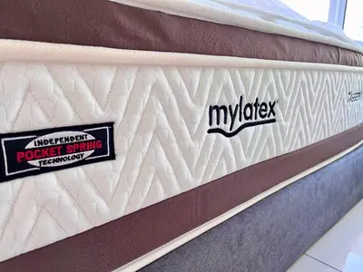 two stickers on the side of a mattress at 2R2B Seaview Serenity 1 to 8pax Gurney Mansion One in George Town