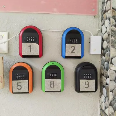 four clocks on a wall with numbers on them at Happy Raub Guest House in Raub