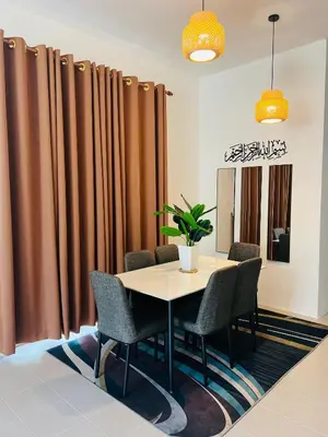 a table and chairs in a room with curtains at Casa Kita Homestay in Bandar Baharu