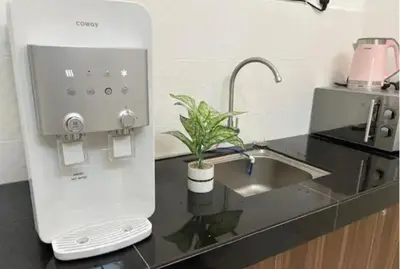 a kitchen with a sink and a mixer on a counter at Legreene Ipoh 15pax in Tambun