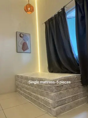 a bed in a room with a window at Legreene Ipoh 15pax in Tambun