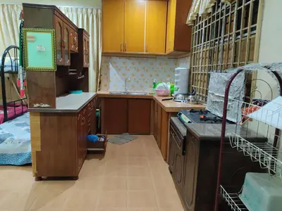 a kitchen with a sink and a stove top oven at Penang Green Homestay Ground Floor in Permatang Pauh