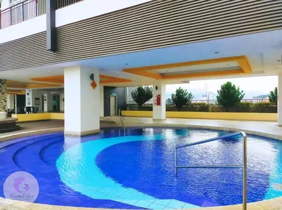 a large blue swimming pool in a building at The Majestic Condo Ipoh Home Fairy 5 in Ipoh